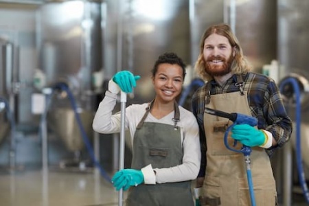 two-cleaning-workers-smiling-at-camera-2025-03-08-19-11-23-utc (1).jpg